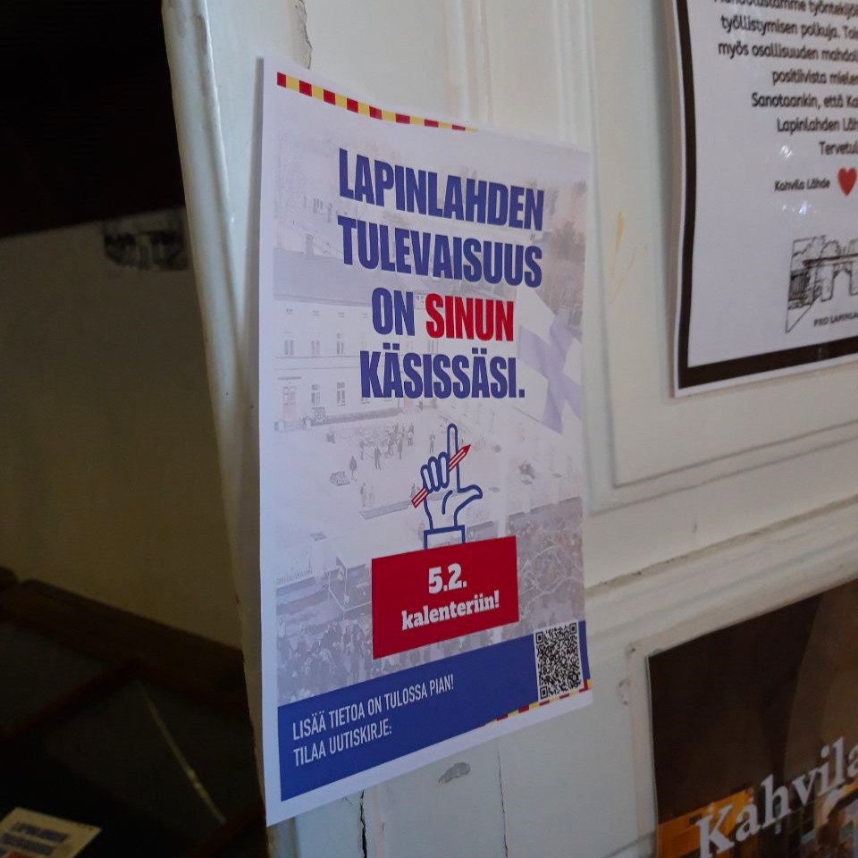Lähikuva ovesta, jossa on mainos, jossa lukee "Lapinlahden tulevaisuus on sinun käsissäsi"